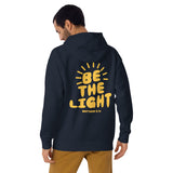 Man Wearing A Navy Be The Light Hoodie